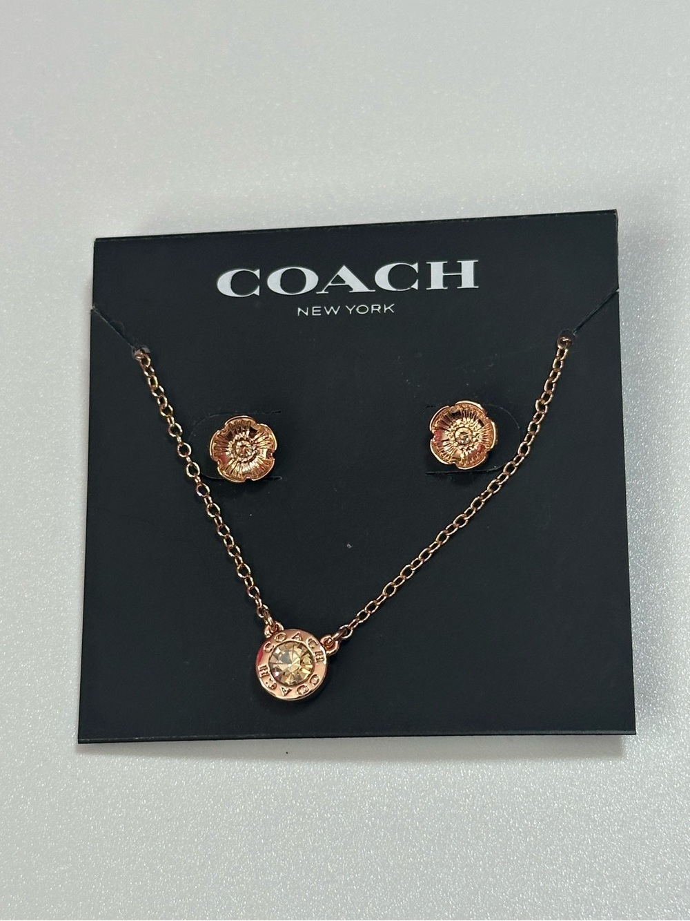 New Coach Rose Gold Tone Floral Earring Studs Rhinestone Open Circle Necklace.